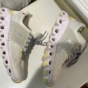 on clouds. comfortable running shoes. worn a couple times. few marks on them.